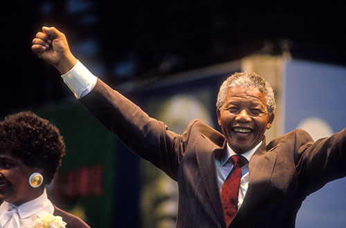 Nelson Mandela greets the crowd at Bobby Dodd Stadium in 1990.