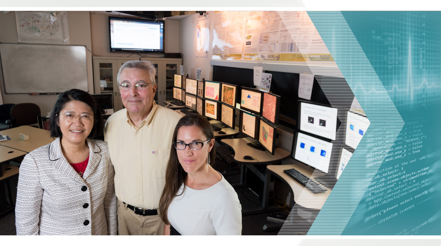 May Dongmei Wang, Paula Braun, and Mark Braunstein in front of a row of computers showing health data