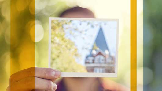photo - strudent holding photo of Tech Towers
