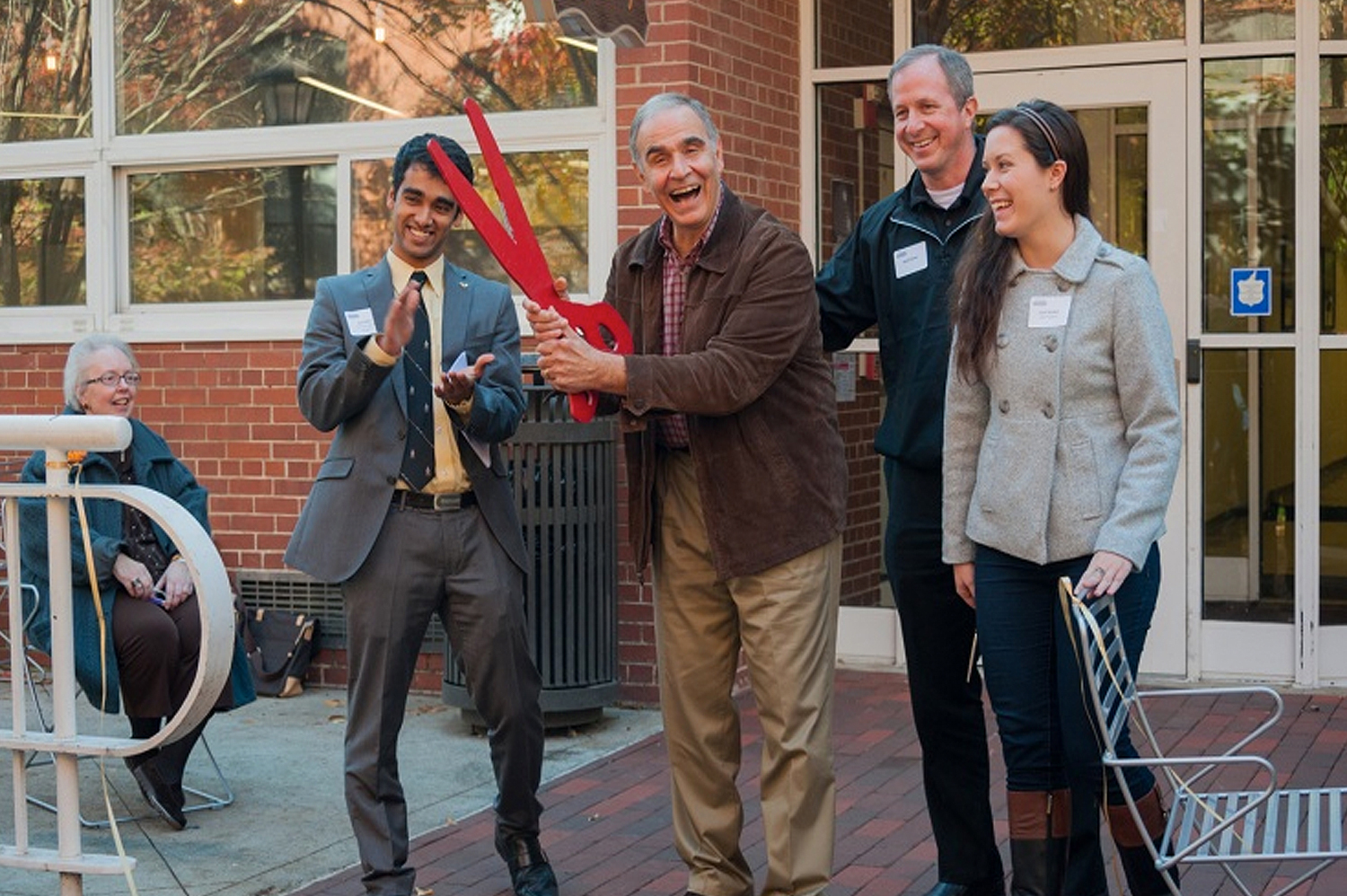 (L-R) Sid Sinha, Tommy Klemis, Walt Ehmer, and Carli Walker celebrate the ribbon cutting for Klemis Kitchen in November 2014. The kitchen officially opened to serve students in spring 2015.