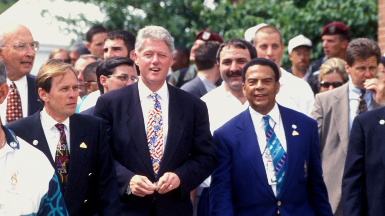 1996 - President Bill Clinton and Atlanta Mayor Andrew Young tour the Olympic Village at Georgia Tech with other Olympic officials. Source: Georgia Tech Library.