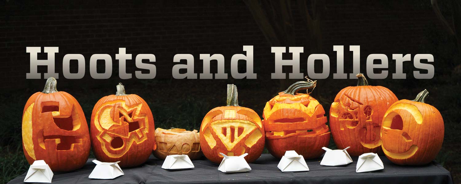 Carved pumpkins in the style of the bauhaus in a row on a table