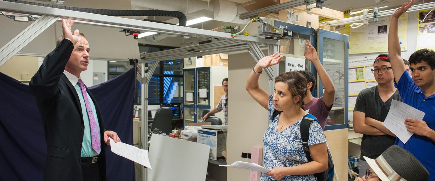 Bill Singhose with students