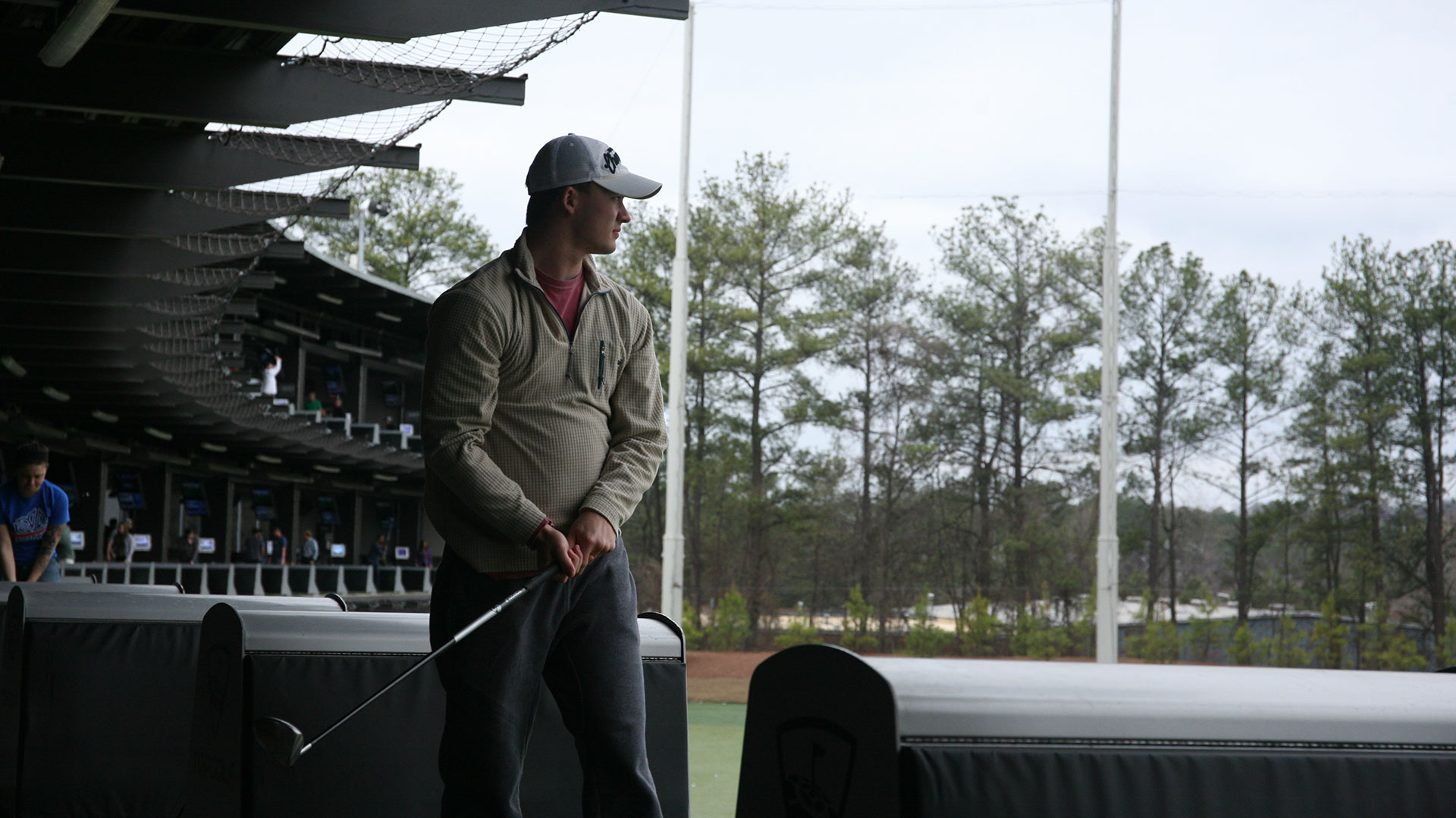 photo - student at golf driving range