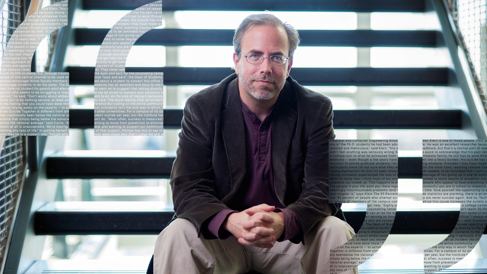 photo - Ben Klein sitting on stairs inside building