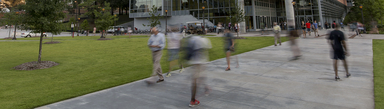 people walk on campus