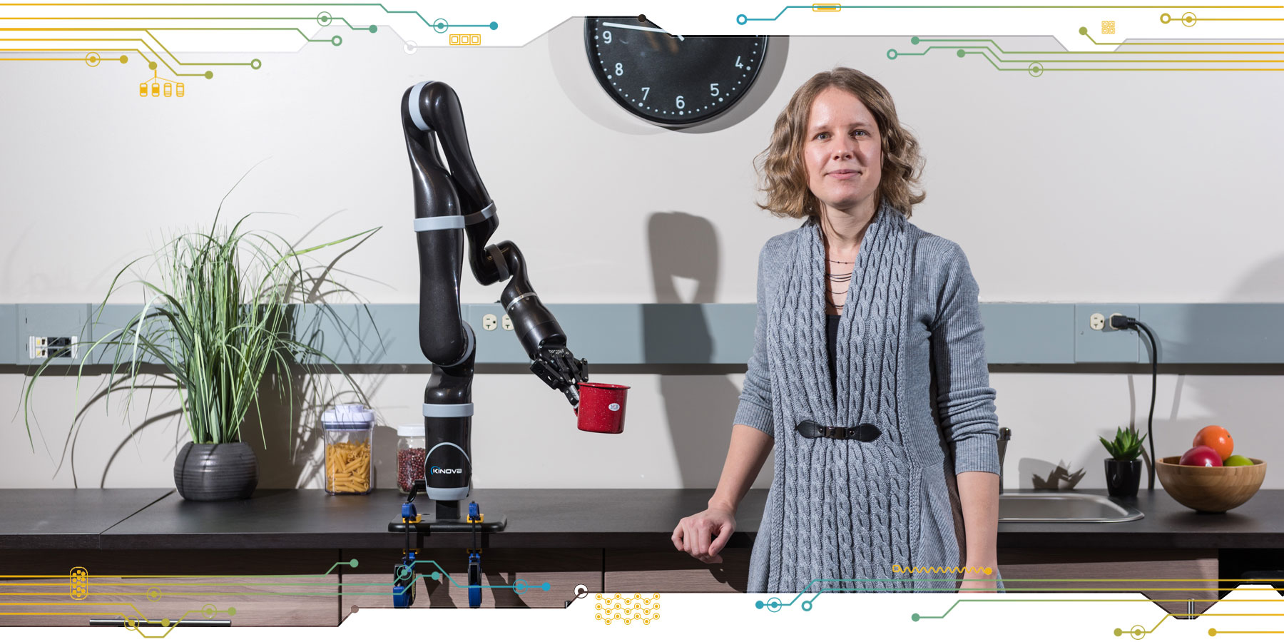 Researcher Sonia Chernova with a robot arm being trained to grasp objects
