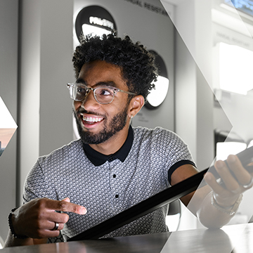 A happy Georgia Tech student at an internship location