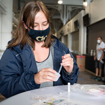 Emily Crawford participates in surveillance testing at the Bobby Dodd Stadium test site. (Credit: Allison Carter, Georgia Tech)