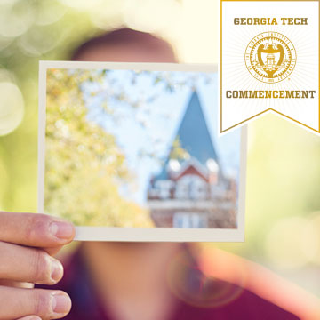 photo - man holding photo of Tech Tower