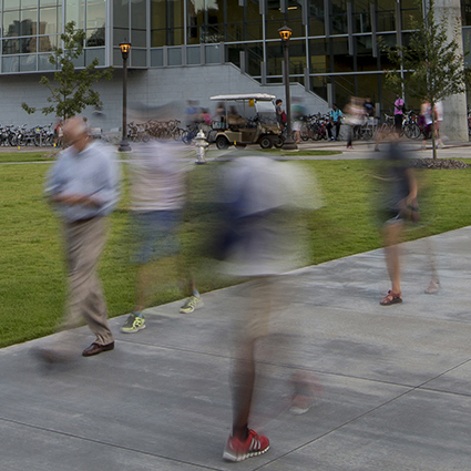 people walking on campus