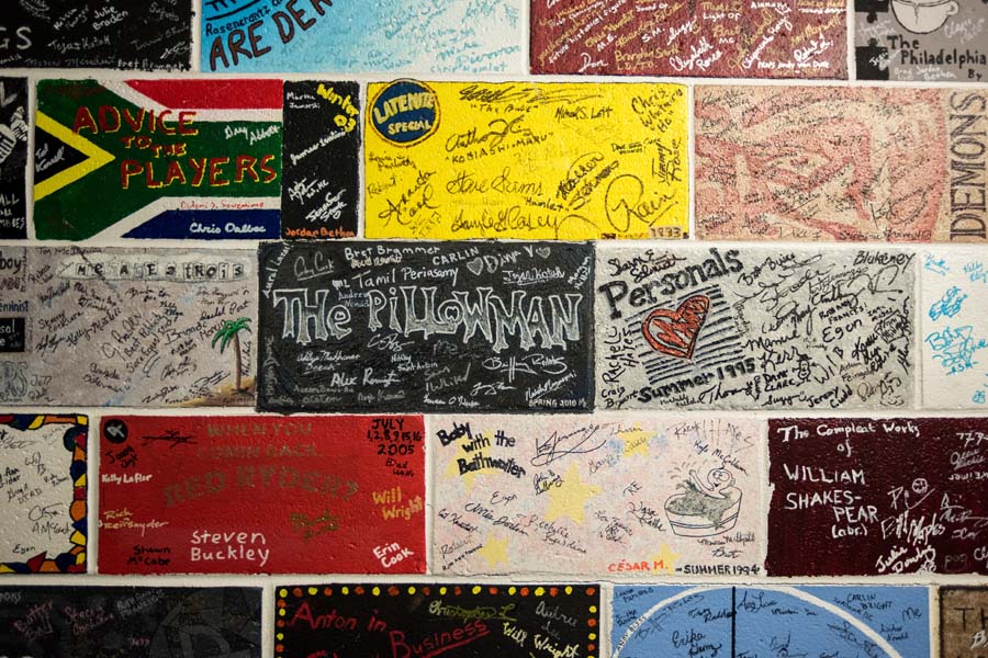 The cast and crew of each show make their mark on the bricks along DramaTech’s stairwell.