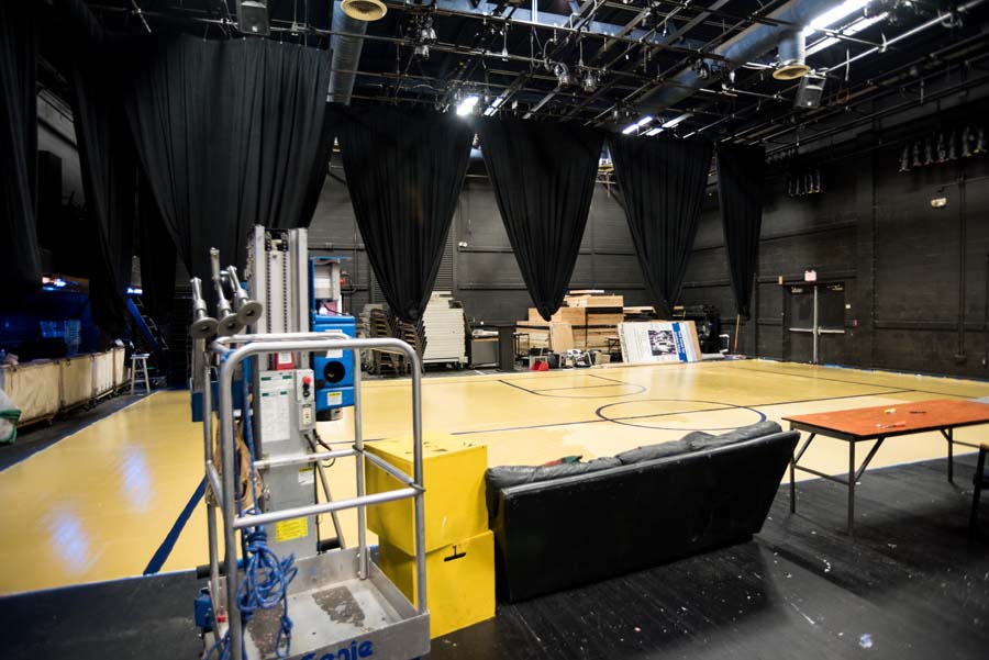The black box theater can be configured to best meet the needs of a show. This photo shows the transformation to a gymnasium floor.
