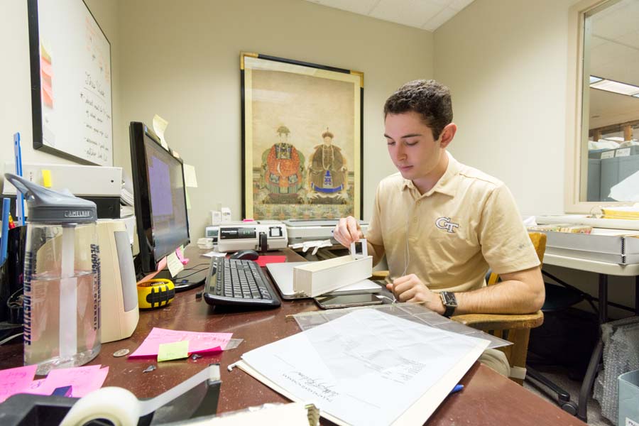 Industrial design student Josh Madwed is digitizing the museum’s slide collection of paper artists.