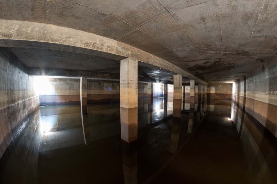 Inside the reservoir system: The floor is covered with water, and the concrete ceiling is 2 feet thick.