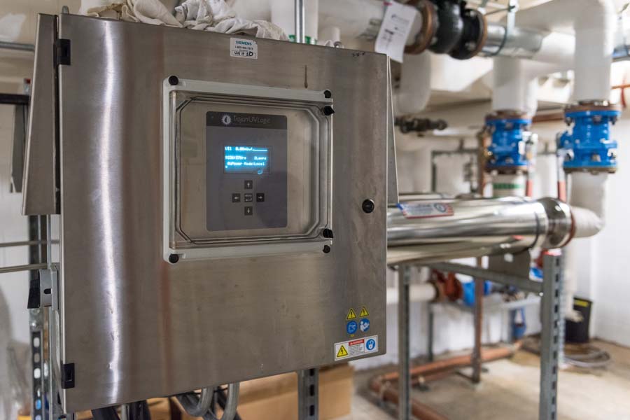 The water treatment equipment in Clough Commons eliminates harmful microorganisms before the water is repurposed. The treatment system includes ultraviolet lighting and a variety of filtering mechanisms.