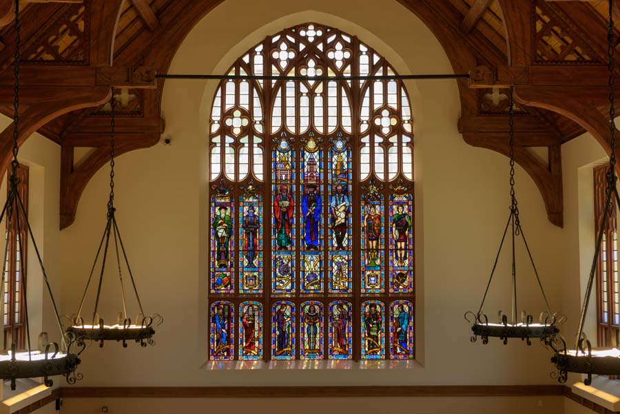 The southern wing of Brittain Dining Hall features a large stained-glass window, depicting allegorical figures of the disciplines at Georgia Tech, designed by sculptor and Tech alumnus Julian H. Harris.