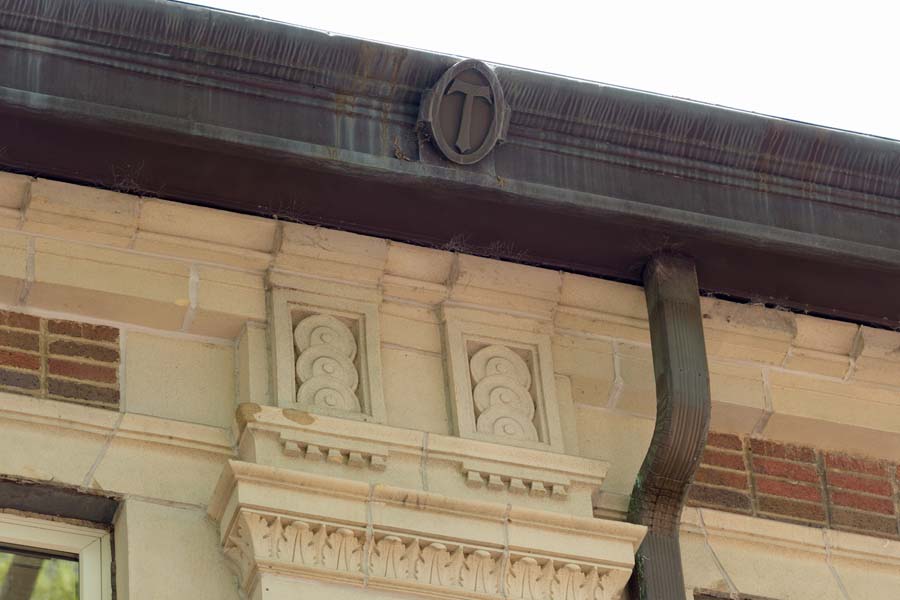 The roof edge of the John Saylor Coon Building is adorned with Ts (for Tech).