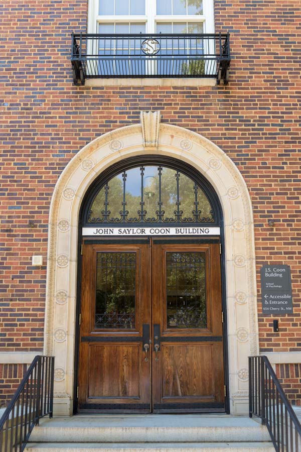 The John Saylor Coon Building entrance (on Cherry Street) is adorned with wrought iron.