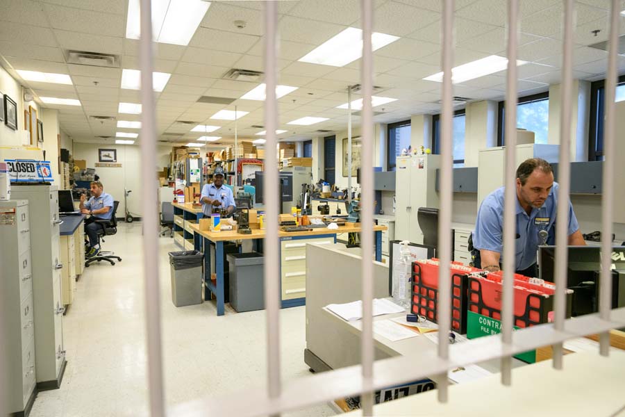 View of the Lockshop through the security bars of the service window.