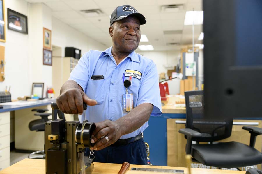 Locksmith Kelly Belton prepares to cut a key.