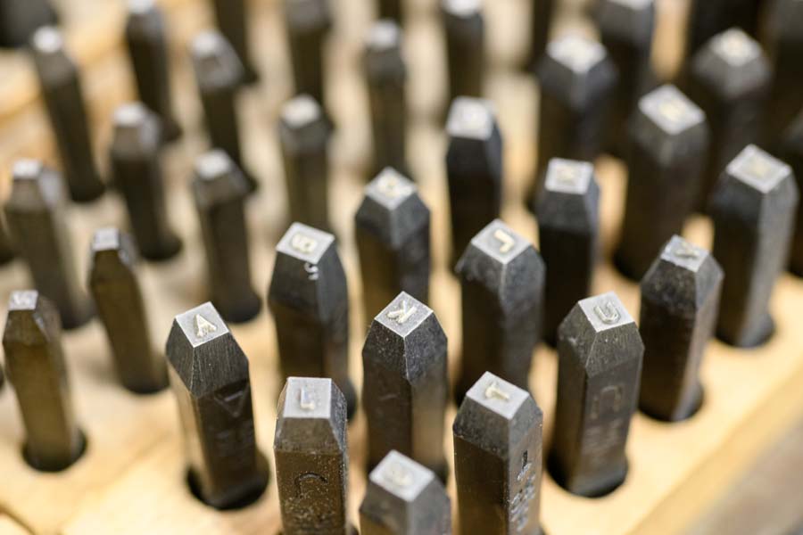 Hand-stampers are used for stamping keys and lock cores.