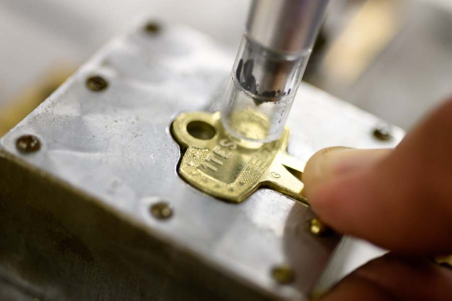 Close-up of inscription of a key code and sequential number.