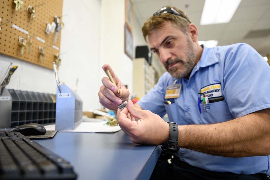 Locksmith Salam Ali puts pins into a lock so the user’s key will work.
