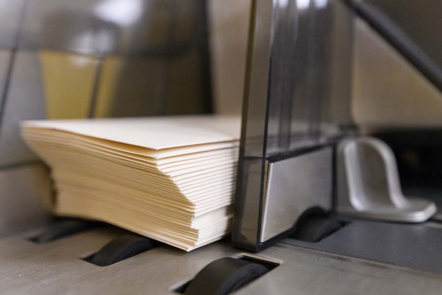 The Distribution Center processes outgoing mail, such as this stack of letters.