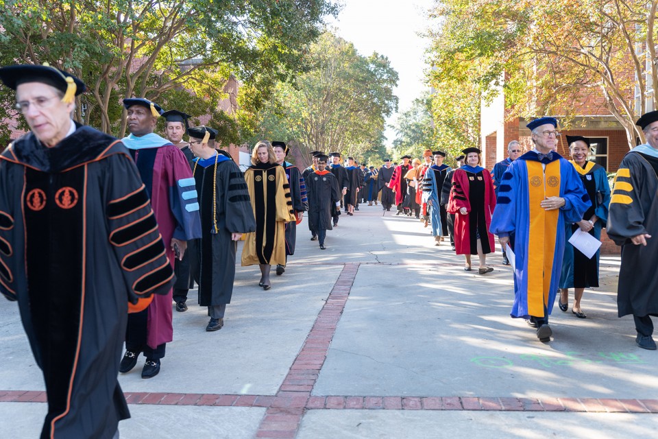 Faculty members and guests process from the Student Center to the Ferst Center for the Arts.