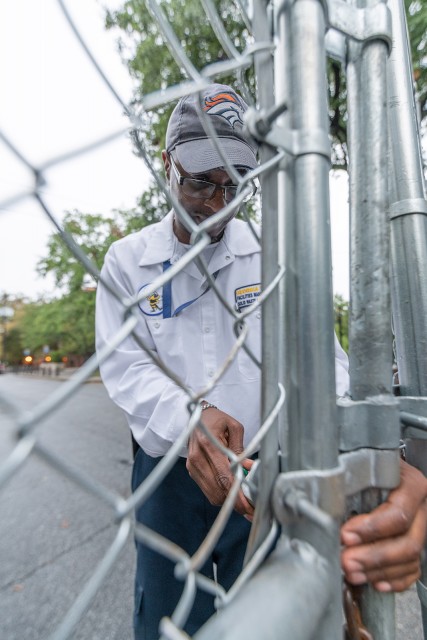 Shawn Dunham, foreman of the recycling crew, unlocks the gate at the Center to allow trucks to service the bins.