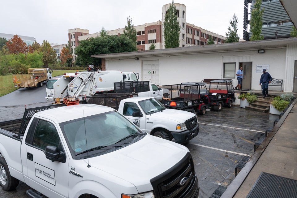 Located at 947 Atlantic Drive, Tech’s Office of Solid Waste Management and Recycling has a fleet of vehicles for collecting recyclable material. Pictured are campus recycling specialists Rodney Scott and Cordell Robinson.