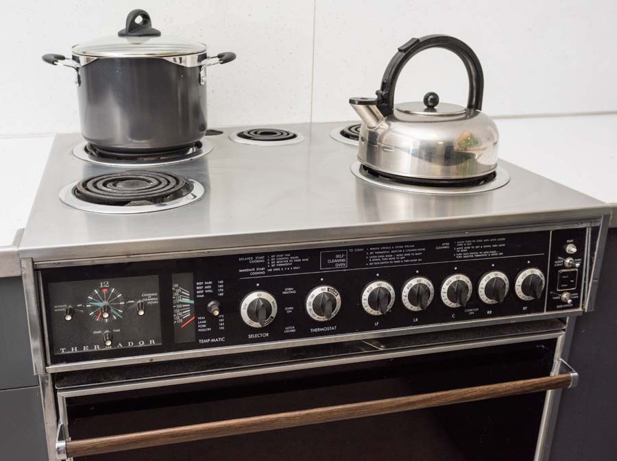 On the first floor of the house, ceilings are 9’ 4” and doors are 9’ tall, including sliding doors. Throughout the house the woodwork is natural blond except in the three bathrooms and two kitchens. The dining and living rooms have blond birch walls from floor to ceiling.