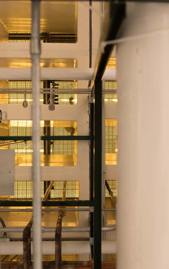 This is the view from beneath the cleanroom, showing holes in the floor that aid in air circulation.