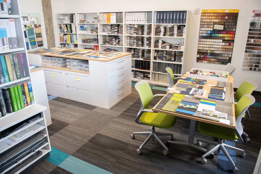 The designers spend a lot of time in the O’Keefe Interiors Library, which is stocked with sample books — carpet, fabric, laminate, and furniture — for finishing projects.