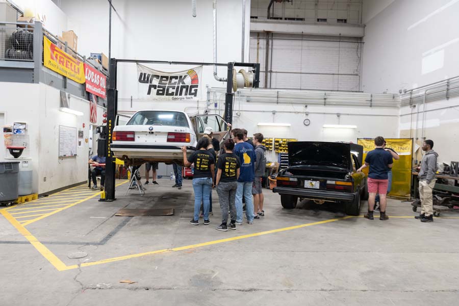 Wreck Racing’s training car, called Doris, is the early-90s white BMW pictured on the left.