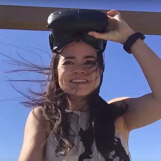 Elisabetta Matsumoto flipping up a visor while her hair blows in the wind