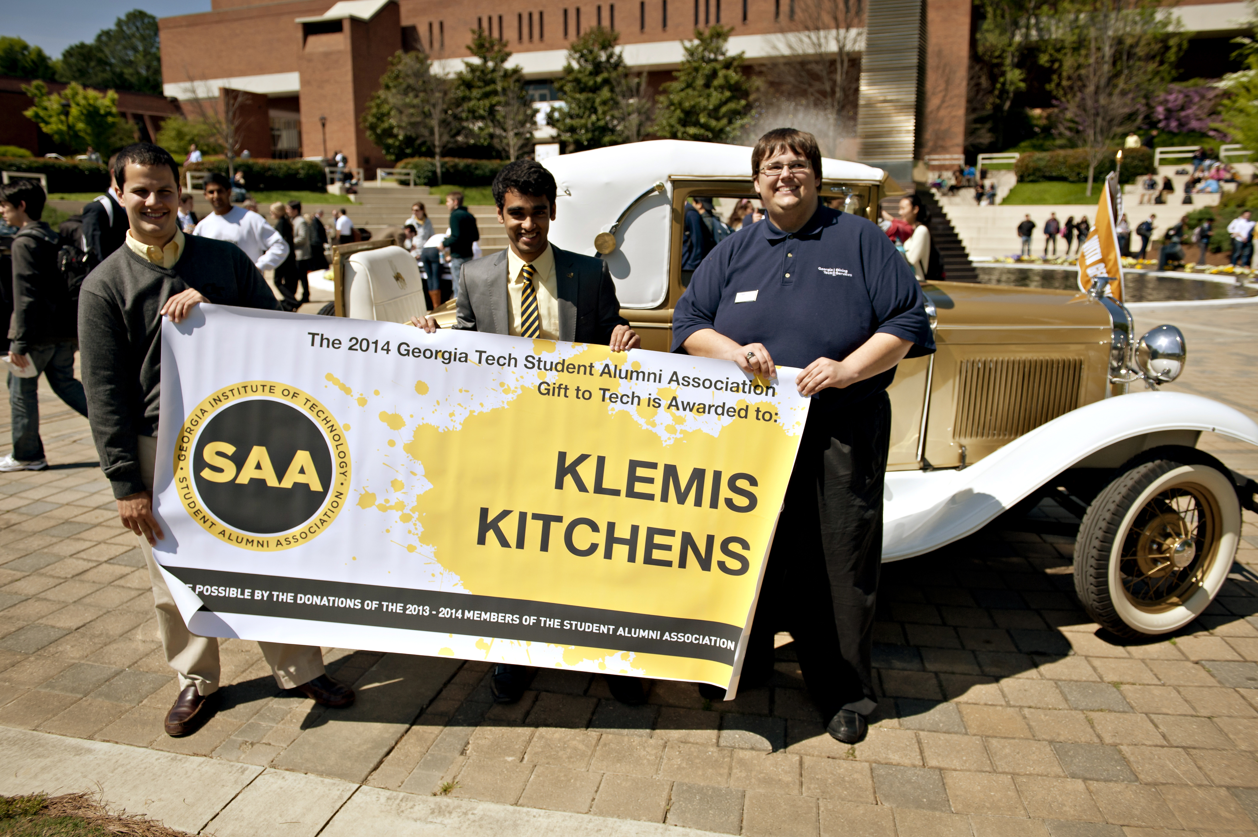 Students Nick Picon, Sidhartha Sinha, and Grant Grimes accept the 2014 Gift to Tech at a ceremony at the Kessler Campanile. Their Klemis Kitchen project won $31,000.