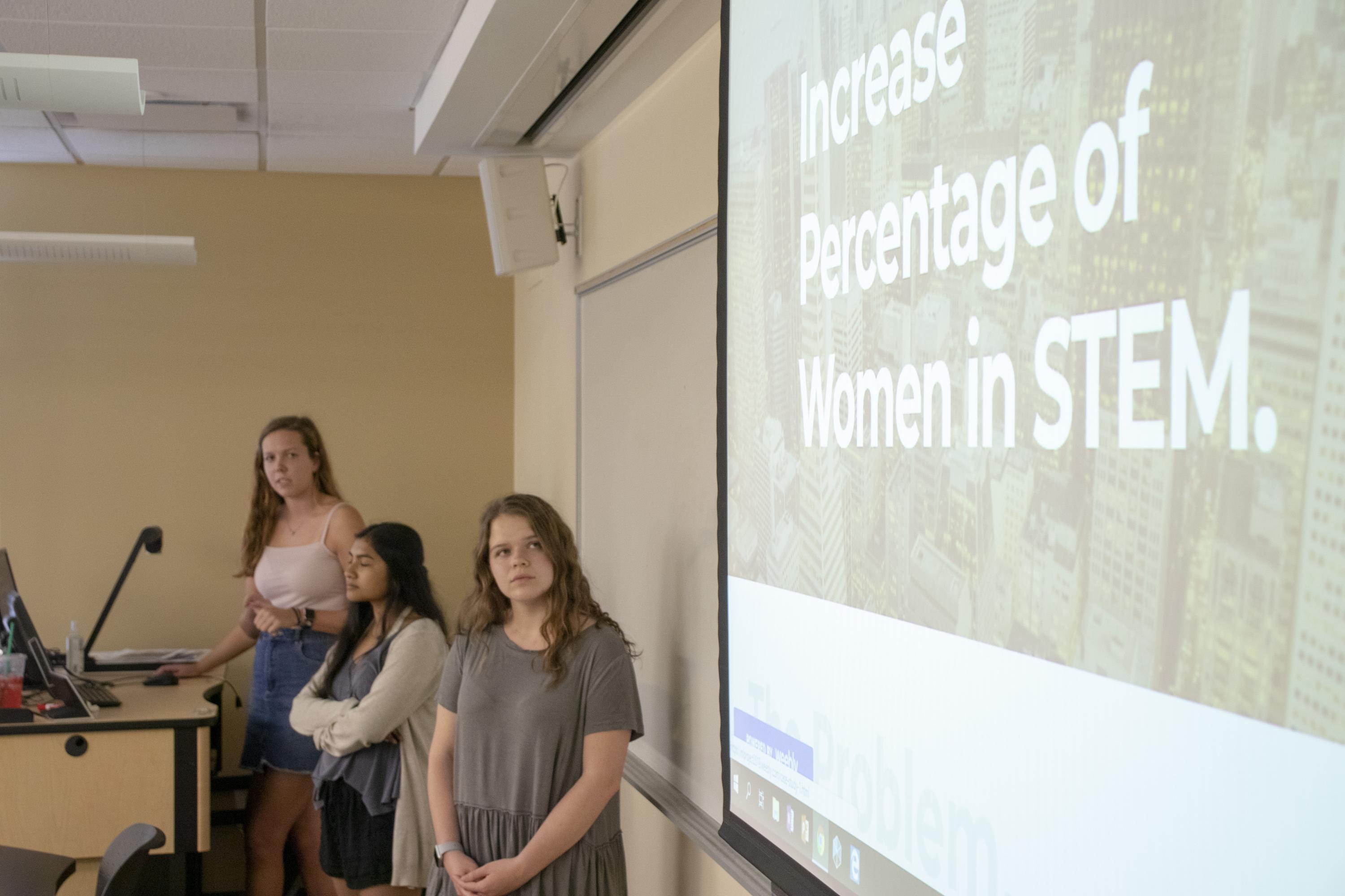 From left, first-year students Caitlyn Beals, Sabirah Haque, and Juliet Orth, present their Humanities in the Field project as part of the Career Design for Global Citizenship class on April 17, 2019. For their project, the students, who are residents of the Global Leadership Living Learning Community, researched companies that work to create increased access to education for underrepresented and disadvantaged communities, in Atlanta and nationally.