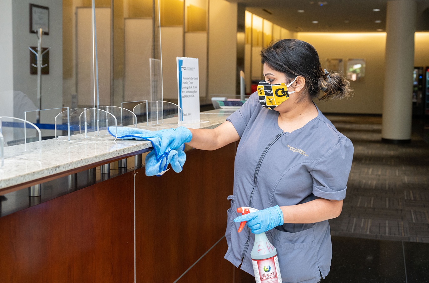 Campus building cleaning while wearing a face covering