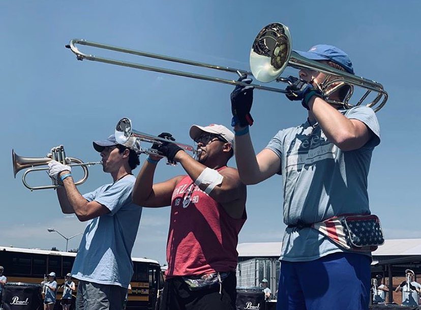 Brent Murphy (right) practices the trombone part of a brass trio at one of Spirit of Atlanta's camps during the spring semester. Credit: Brent Murphy, Instagram