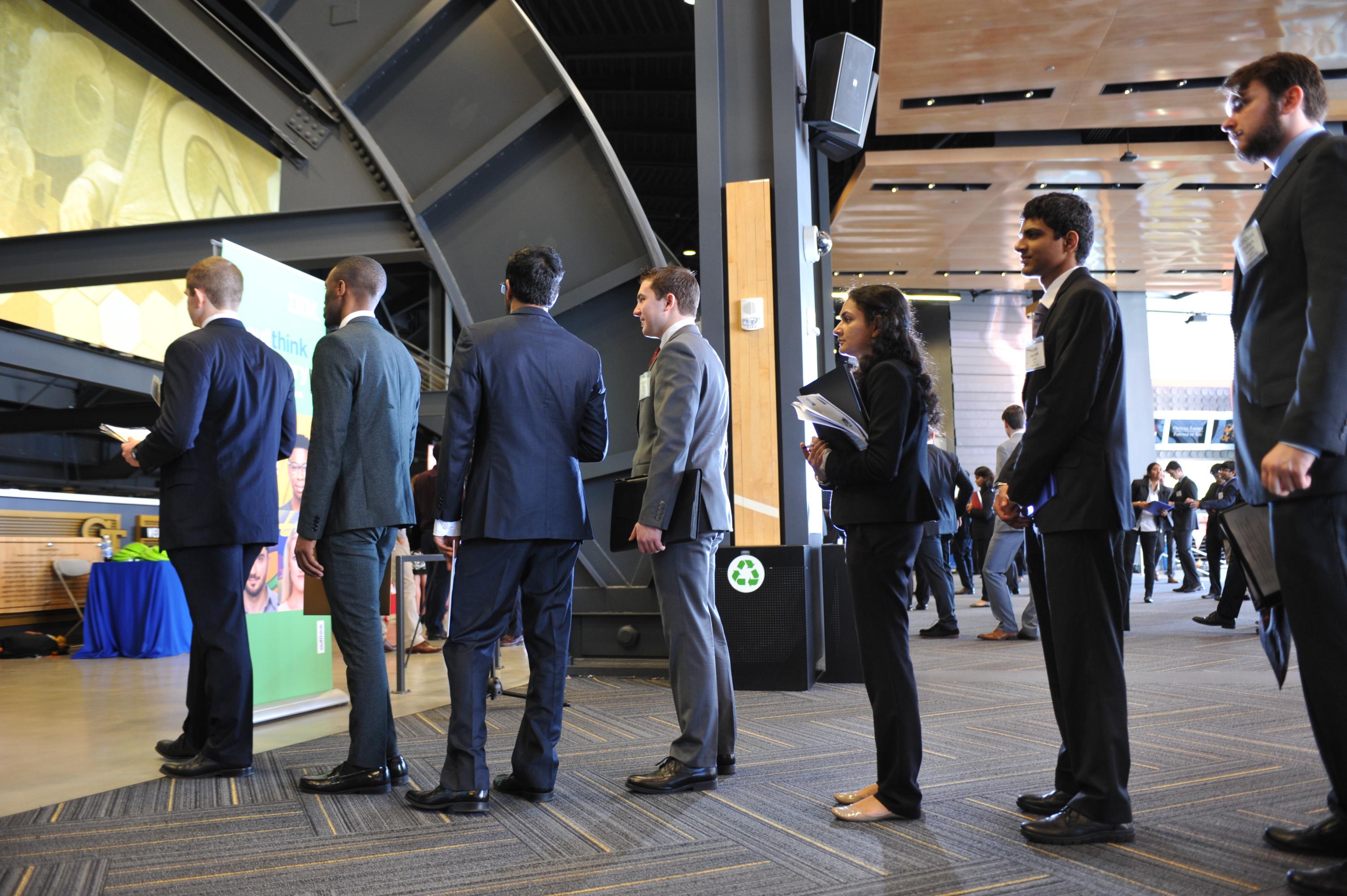 Students wait in line to talk to a recruiter at the spring all-majors career fair.
