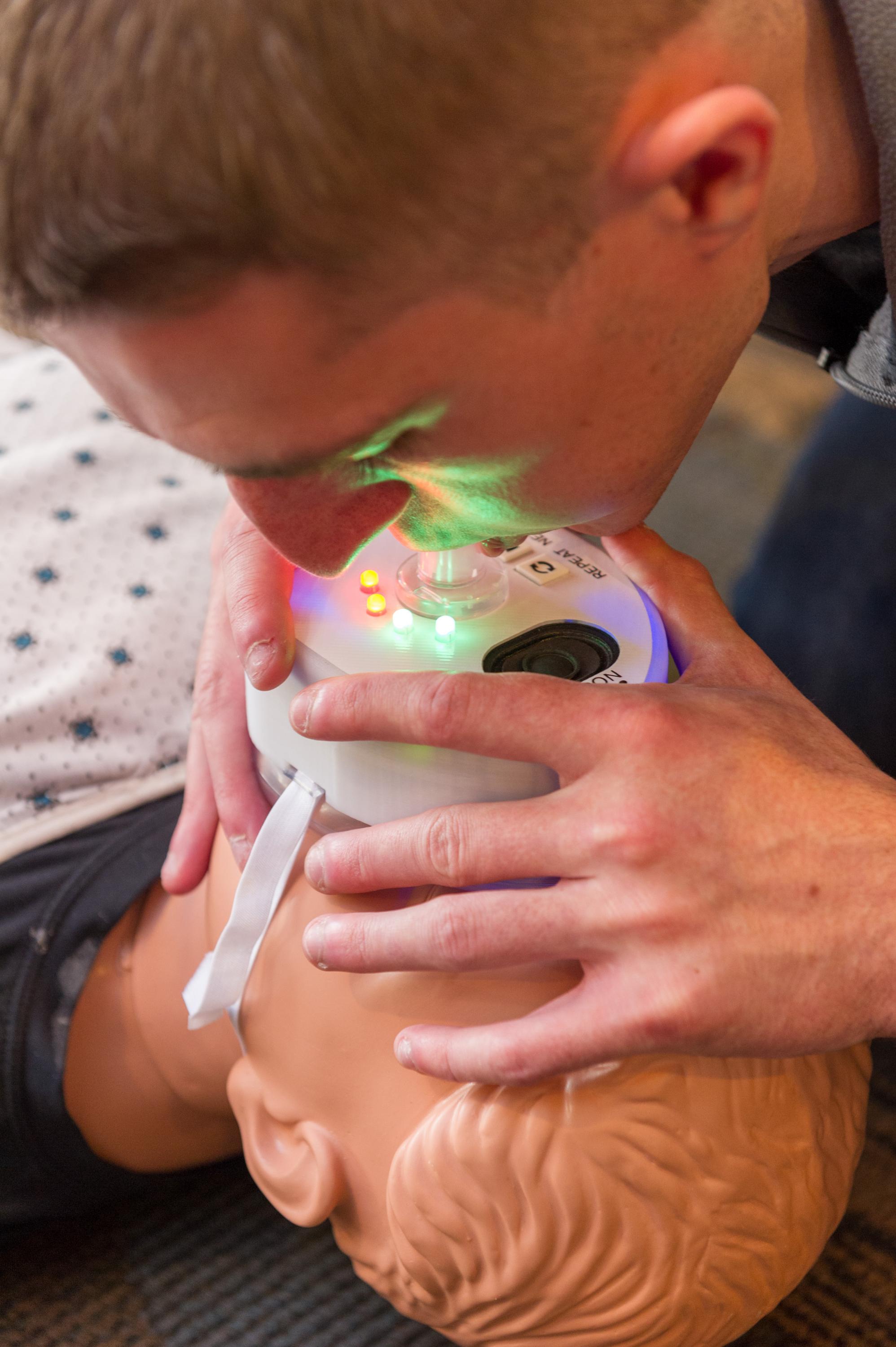 CPR+ is a CPR mask with LED lights that offers user feedback throughout the resuscitation process. The device is one of six inventions is competing for Georgia Tech’s 2017 InVenture Prize.
Ryan Williams, a computer engineering major, demonstrates delivering rescue breaths with the device. When done correctly the lights turn green.
The other inventors are: Dave Ehrlich, a computer engineering major, and Samuel Clarke, a mechanical engineering and computer science major.
Photo by Rob Felt.