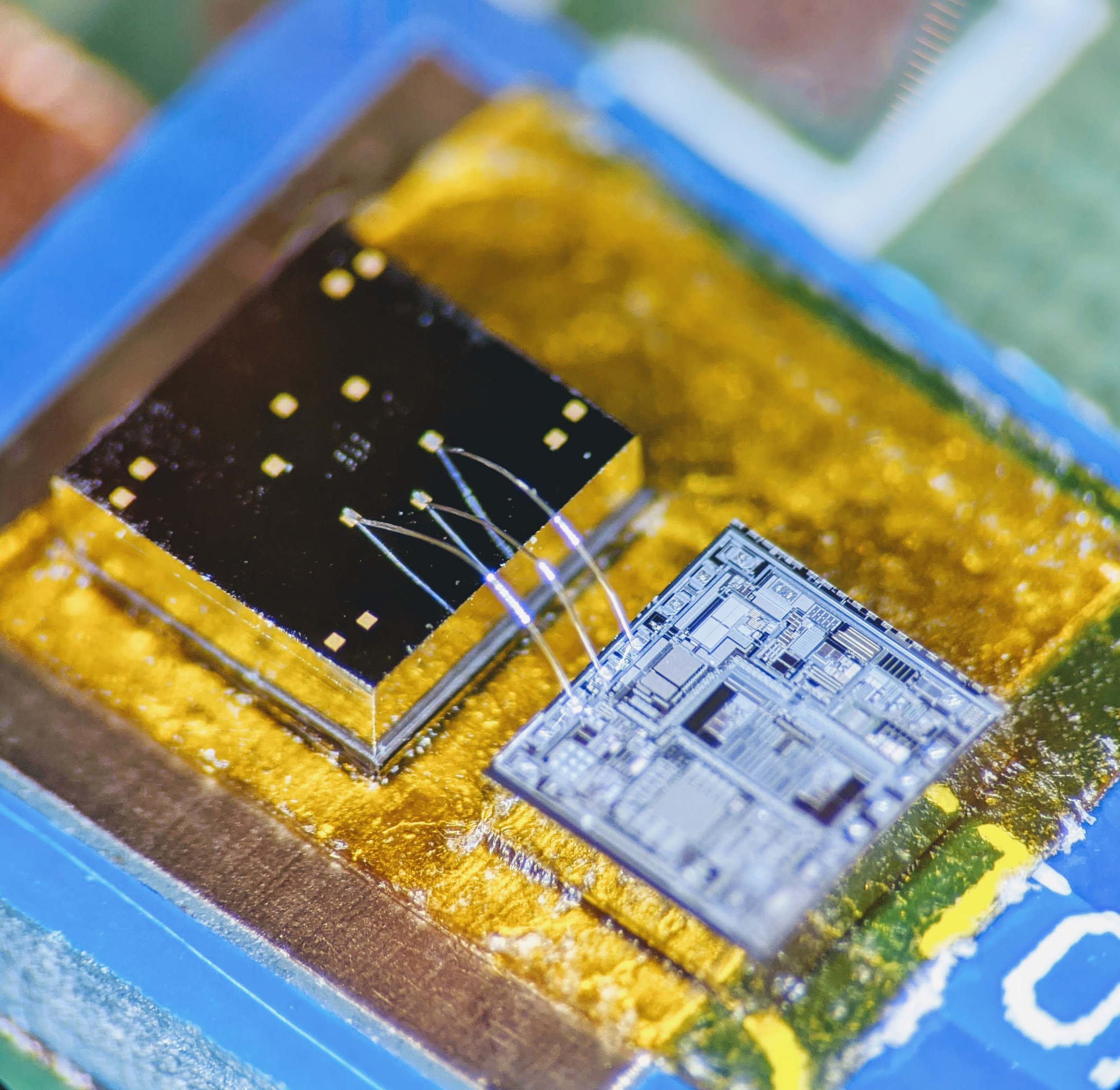 The sensor is a physical chip remarkably attuned to inertia. Next to it, an electronic chip called a signal-conditioning circuit translates the sensor chip’s signals into patterned read-outs. Credit: Georgia Tech / Ayazi lab