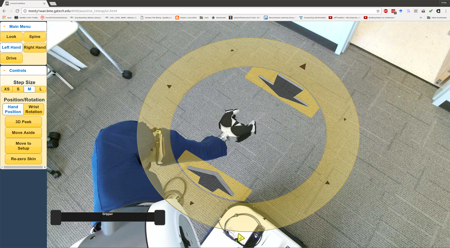 Image shows the view through the PR2’s cameras showing the environment around the robot. Clicking the yellow disc allows users the control the arm. (Credit: Phillip Grice, Georgia Tech) Image shows the view through the PR2’s cameras showing the environment around the robot. Clicking the yellow disc allows users the control the arm. (Credit: Phillip Grice, Georgia Tech)