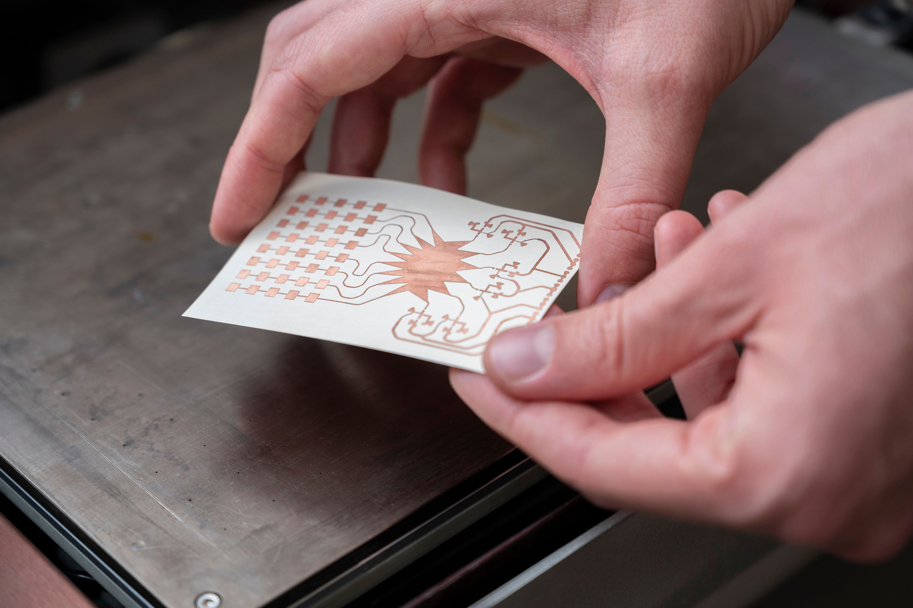 A Georgia Tech ATHENA group member holds an inkjet-printed prototype of a mm-wave harvester. The researchers envision a future where IoT devices will be powered wirelessly over 5G networks. (Photo credit: Christopher Moore, Georgia Tech) A Georgia Tech ATHENA group member holds an inkjet-printed prototype of a mm-wave harvester. The researchers envision a future where IoT devices will be powered wirelessly over 5G networks. (Photo credit: Christopher Moore, Georgia Tech)