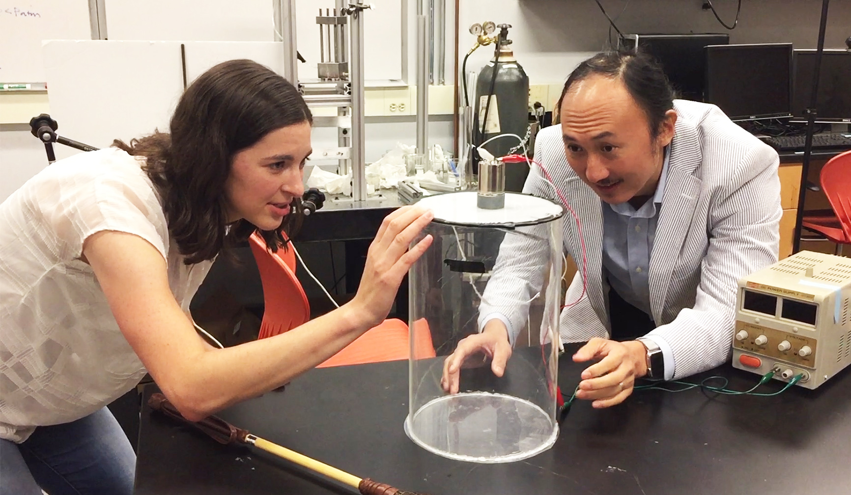 Marguerite Matherne, a mechanical engineering Ph.D. student, and Professor David Hu examine the mammal tail simulator used to study the airflow needed to keep mosquitoes from landing. (Credit: John Toon, Georgia Tech) Marguerite Matherne, a mechanical engineering Ph.D. student, and Professor David Hu examine the mammal tail simulator used to study the airflow needed to keep mosquitoes from landing. (Credit: John Toon, Georgia Tech)