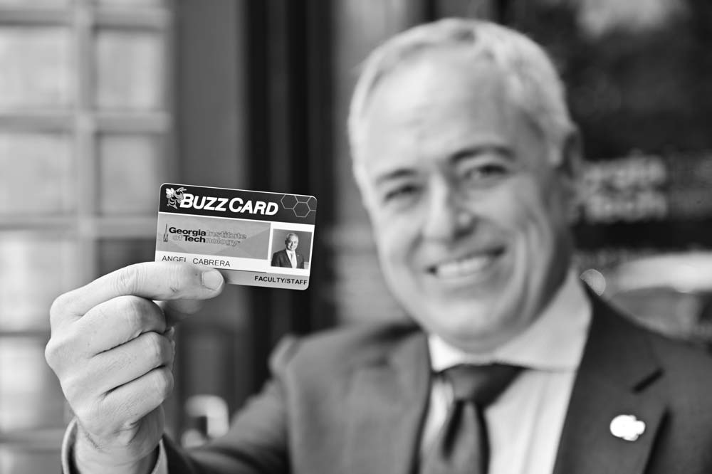 President Ángel Cabrera holds his BuzzCard on his first day on the job as president.