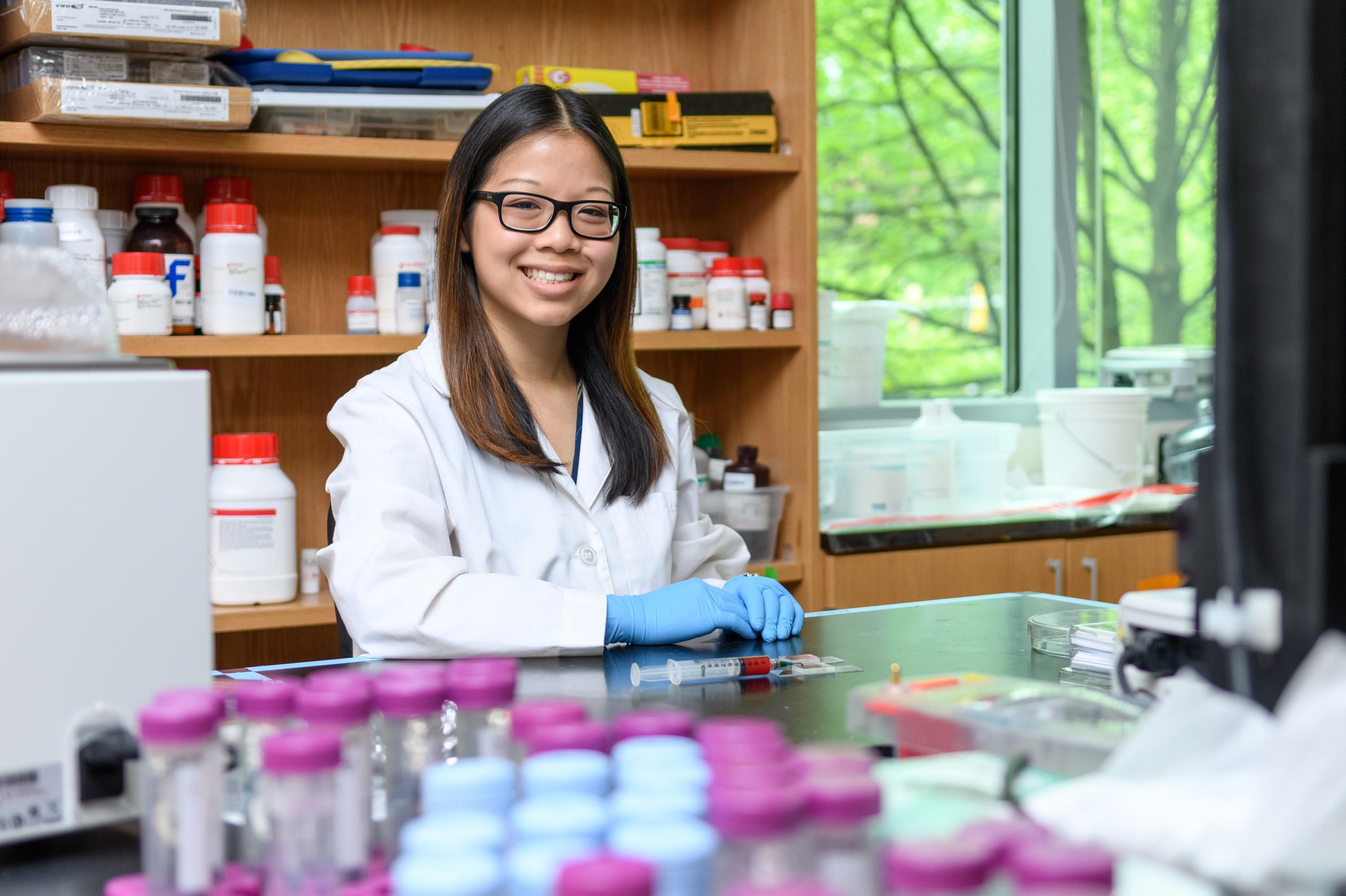 Researchers have developed a potentially new way to introduce macromolecules and therapeutic genes into human cells. Shown is National Science Foundation Graduate Research Fellow Anna Liu. (Credit: Rob Felt, Georgia Tech)