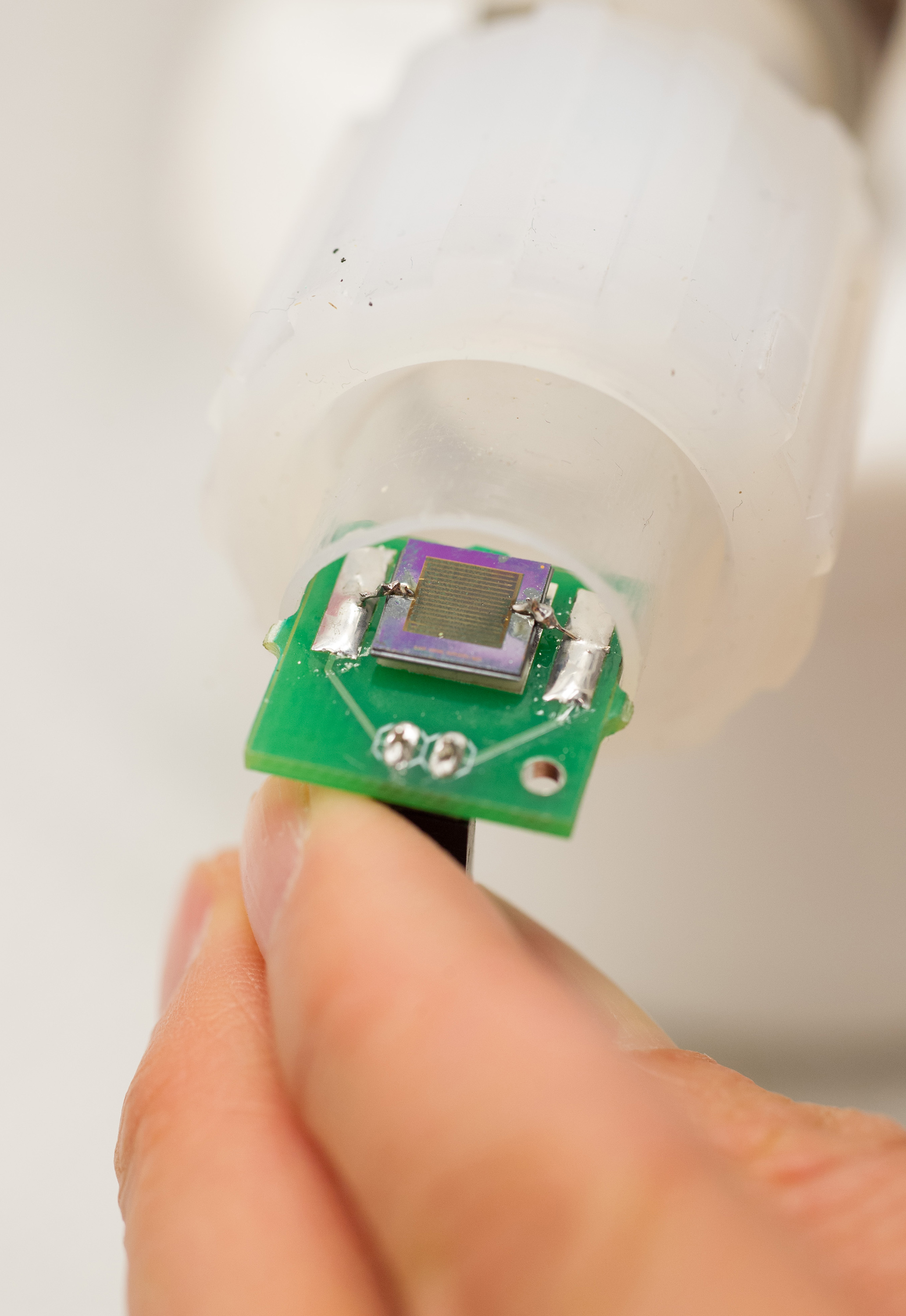 Close-up of a functionalized nanomaterial-based chemical sensor, inside a flow-cell test chamber. (Georgia Tech Photo: Rob Felt)